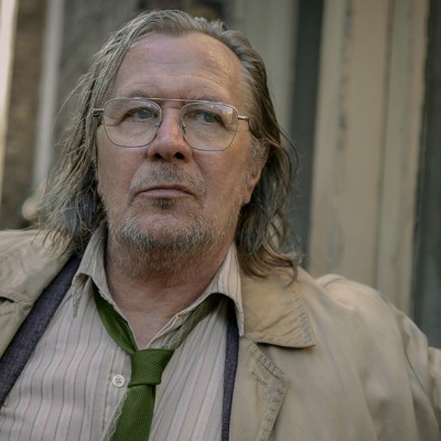 Gary Oldman wearing a dirty coat and tie in Slow Horses season 3